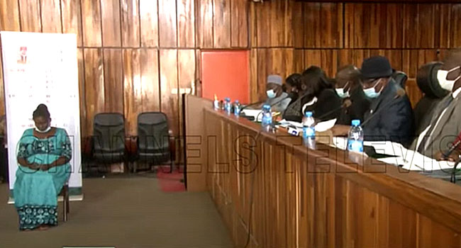 Doris Idedia testifies before the panel.